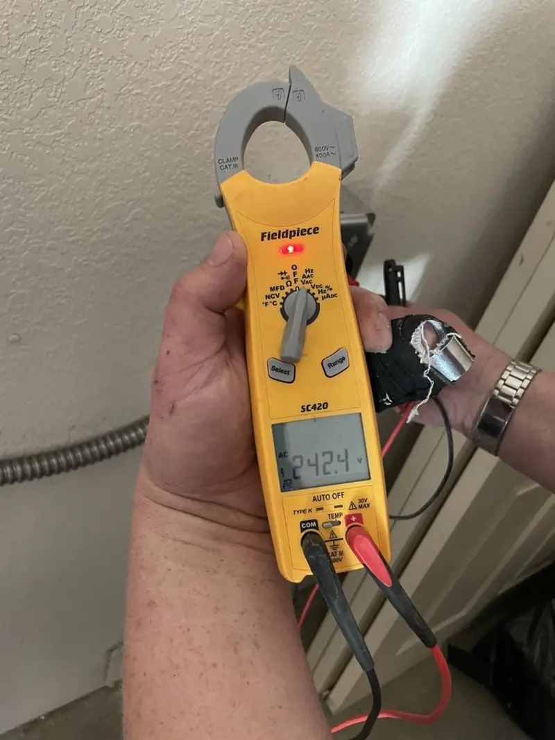 Voltage testing with clamp meter during Ceiling Fan Installation in McCordsville